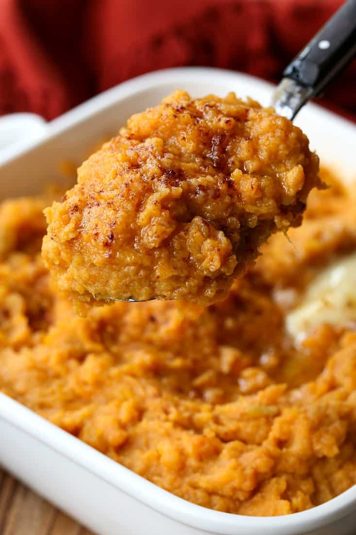 Mashed sweet potatoes on a serving spoon