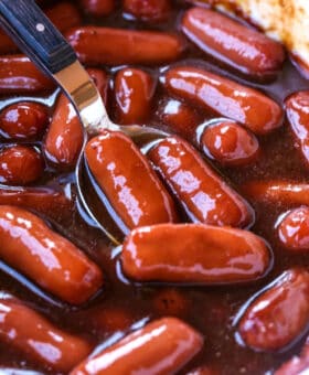 Spoon in a slow cooker with saucy little smokies