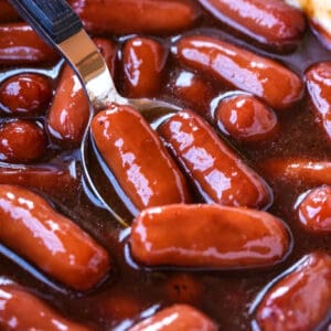 Spoon in a slow cooker with saucy little smokies