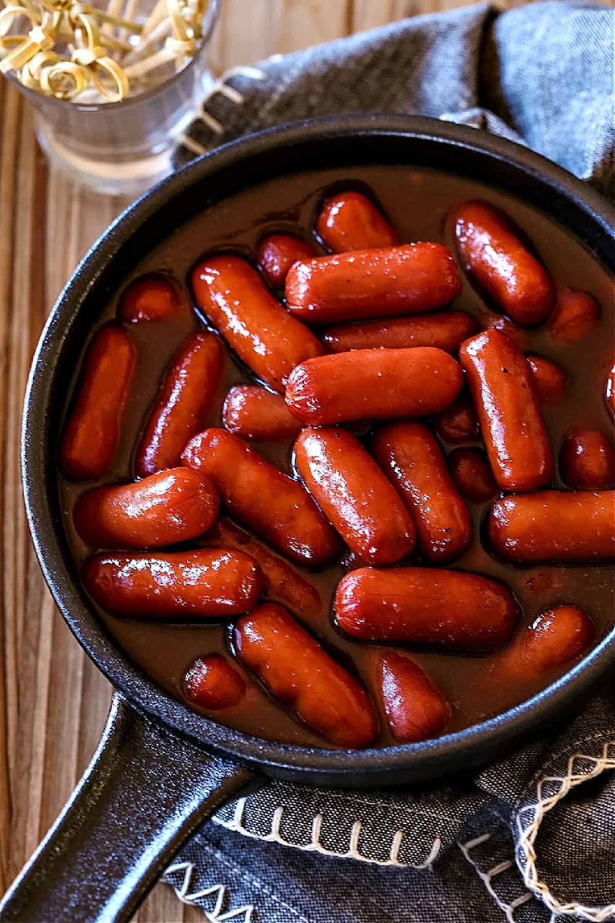 top shot of little smokies in a cast iron skillet
