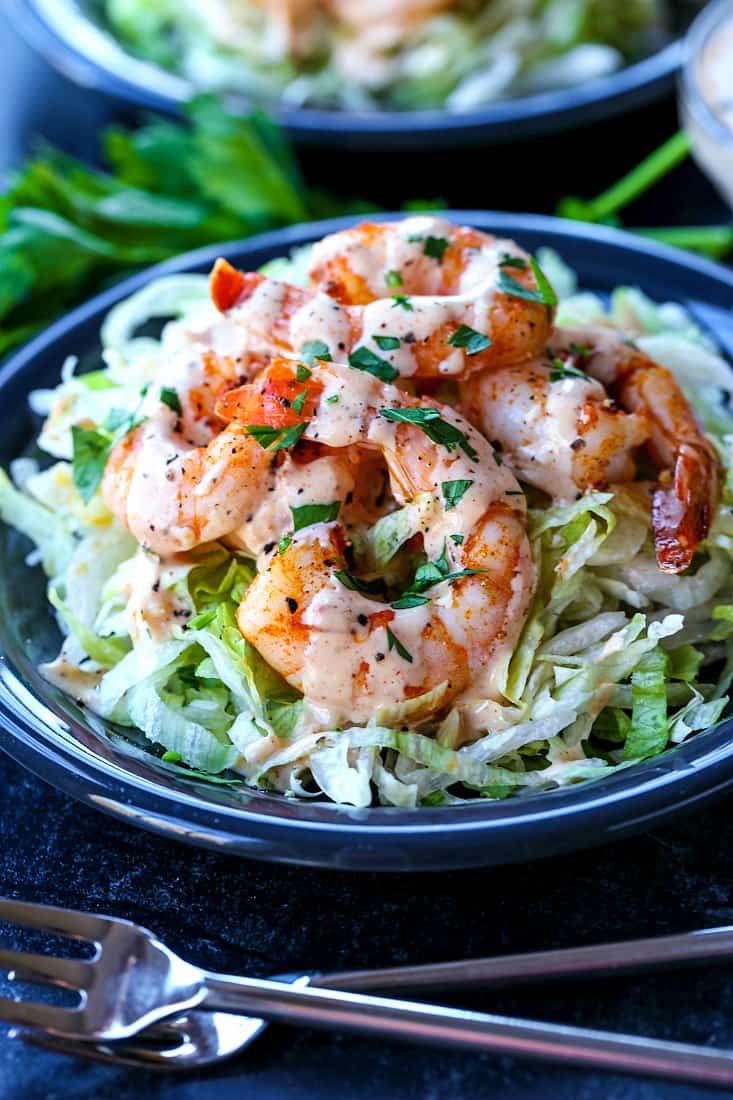 Shrimp Remoulade recipe over lettuce on gray plate