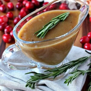 gravy in a gravy boat with rosemary