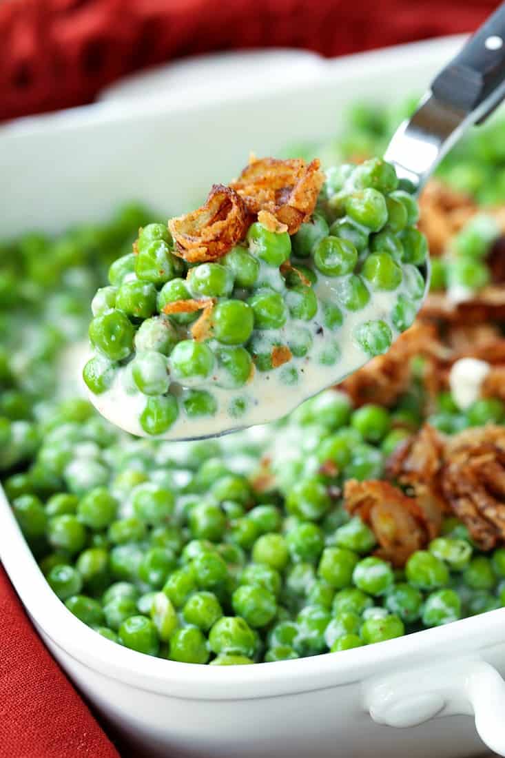 creamed peas in a serving spoon
