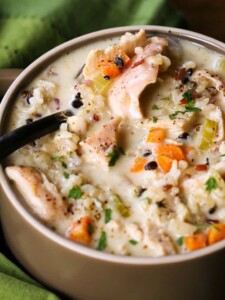 Turkey and rice soup with vegetables on a spoon