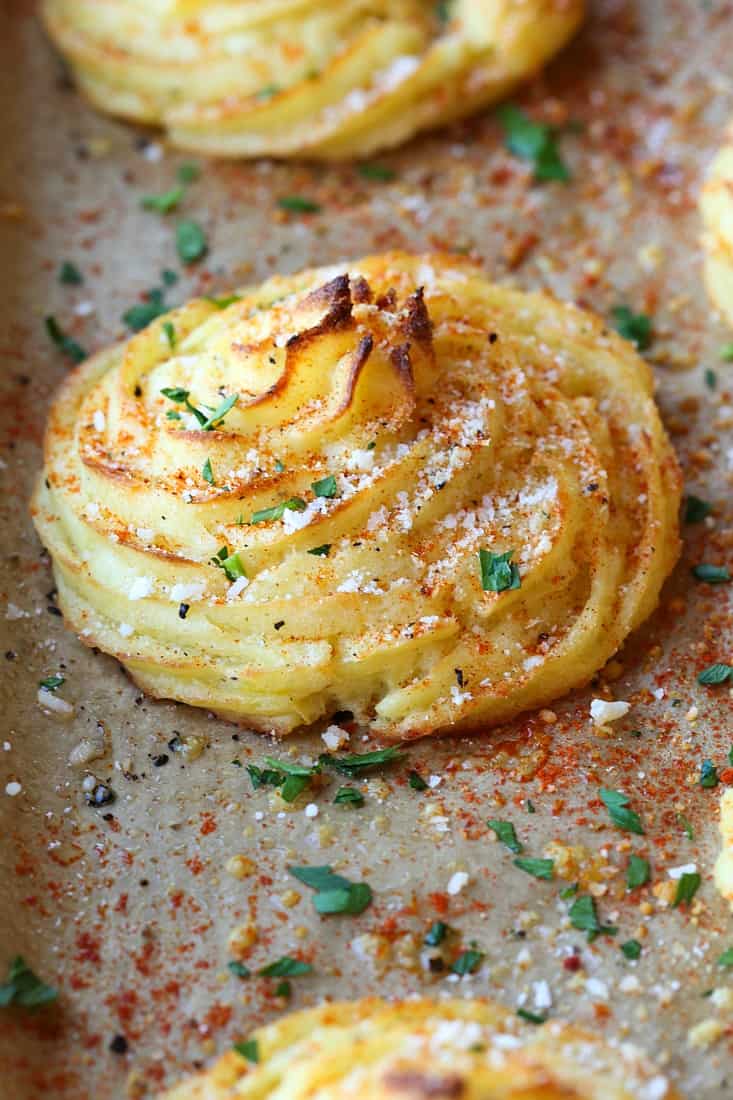 Duchess Potatoes on a parchment lined baking sheet