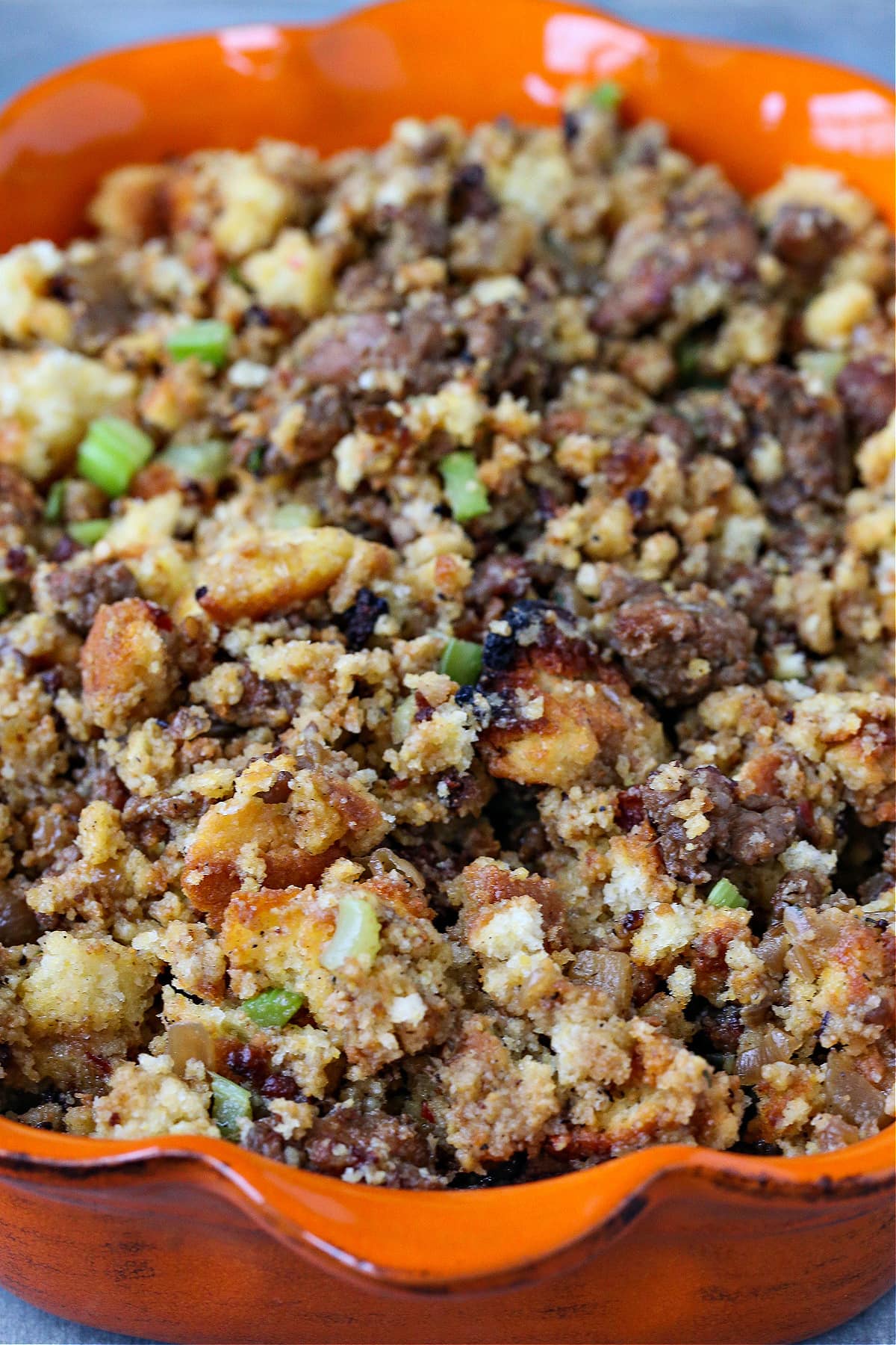 uncooked cornbread dressing in baking dish