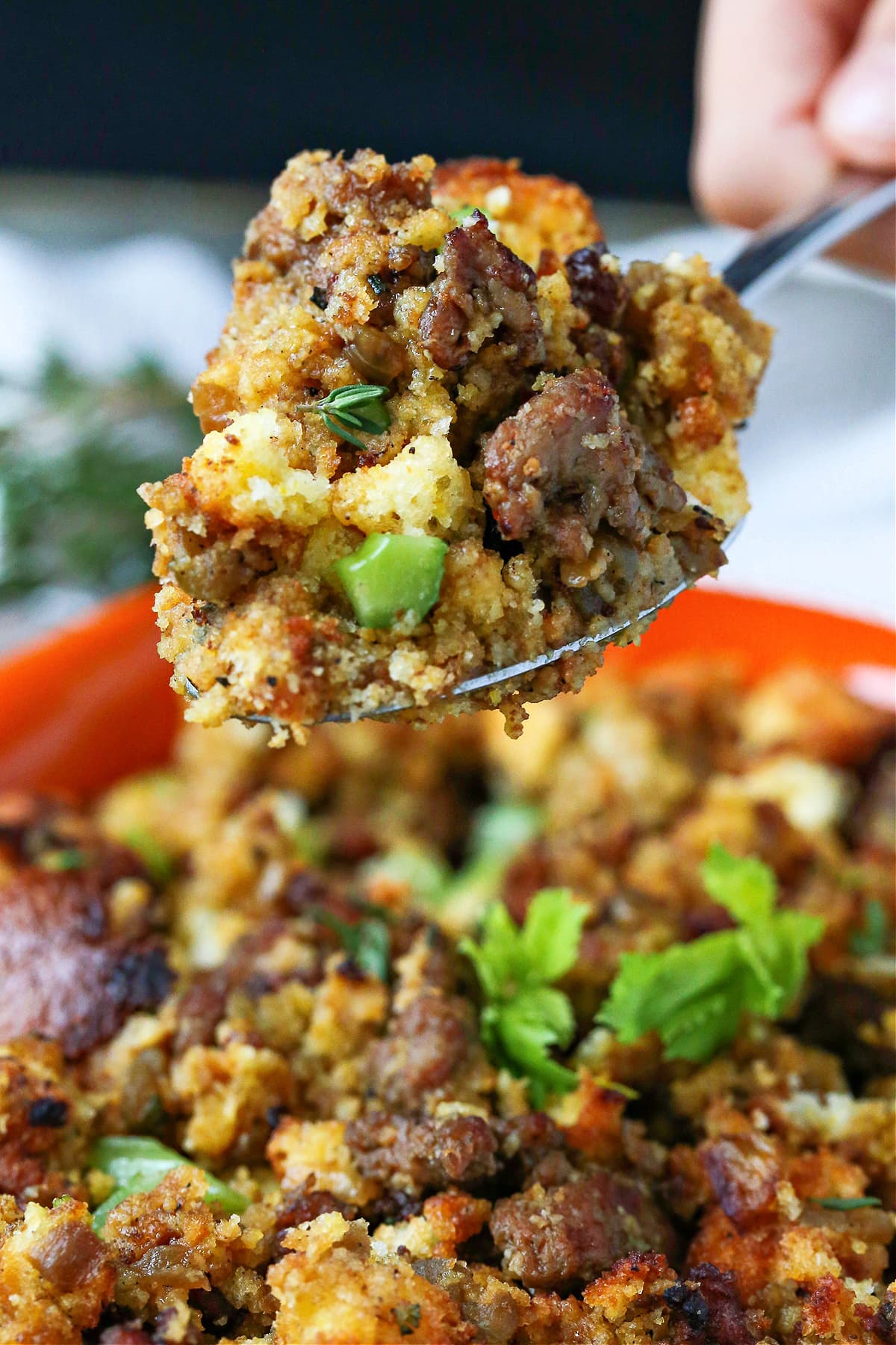 sausage cornbread dressing on serving spoon