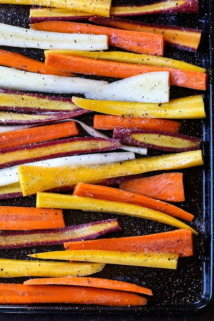 carrots on a baking sheet before roasting