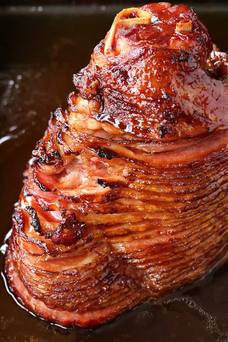 baked spiral ham in a roasting pan