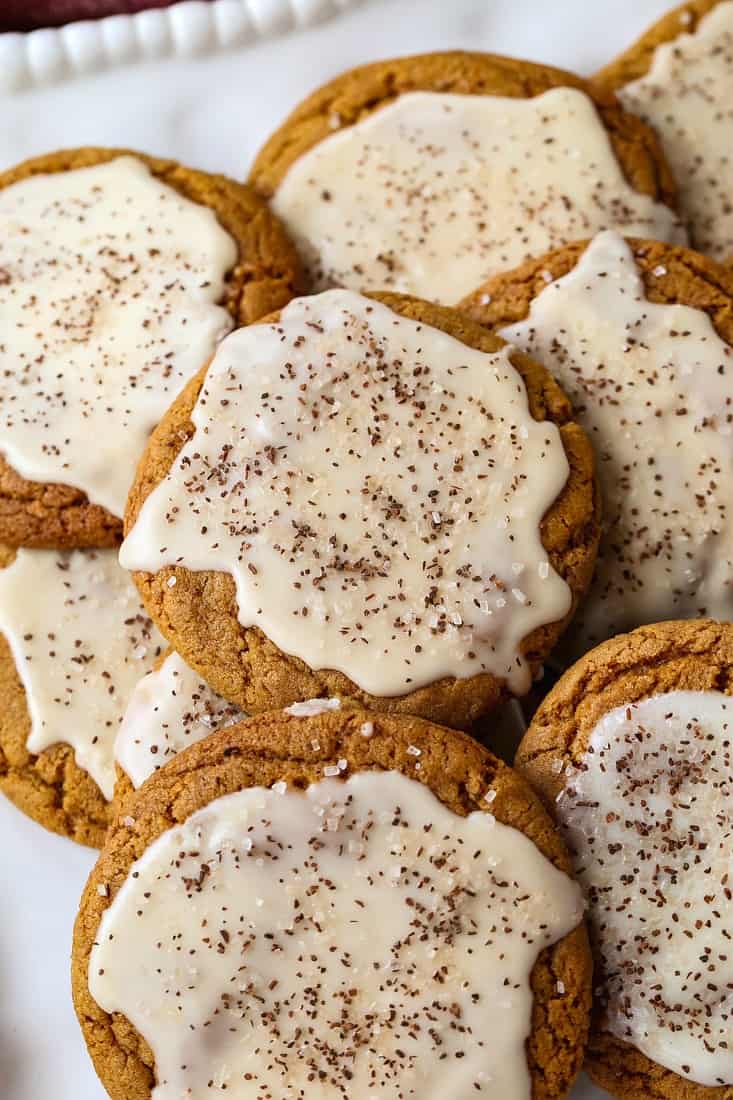 Bourbon Iced Molasses Cookies are going to be the star of your dessert table! A bourbon infused icing makes these cookies a party favorite! Bourbon Iced Molasses Cookies with bourbon infused glaze