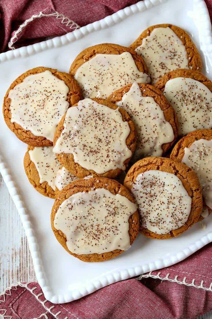 Bourbon Iced Molasses Cookies are going to be the star of your dessert table! A bourbon infused icing makes these cookies a party favorite! Iced Molasses Cookies with bourbon frosting