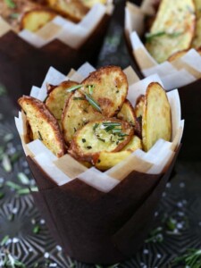 Roasted fingerling potatoes in paper cups with fresh roasemary