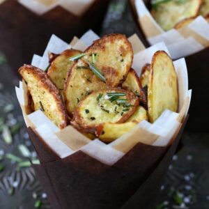 Roasted fingerling potatoes in paper cups with fresh roasemary