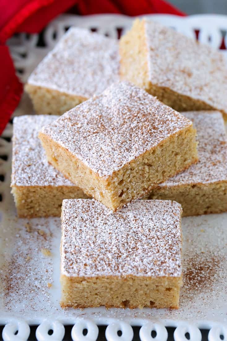 Cookie bars stacked on a platter with red napkin