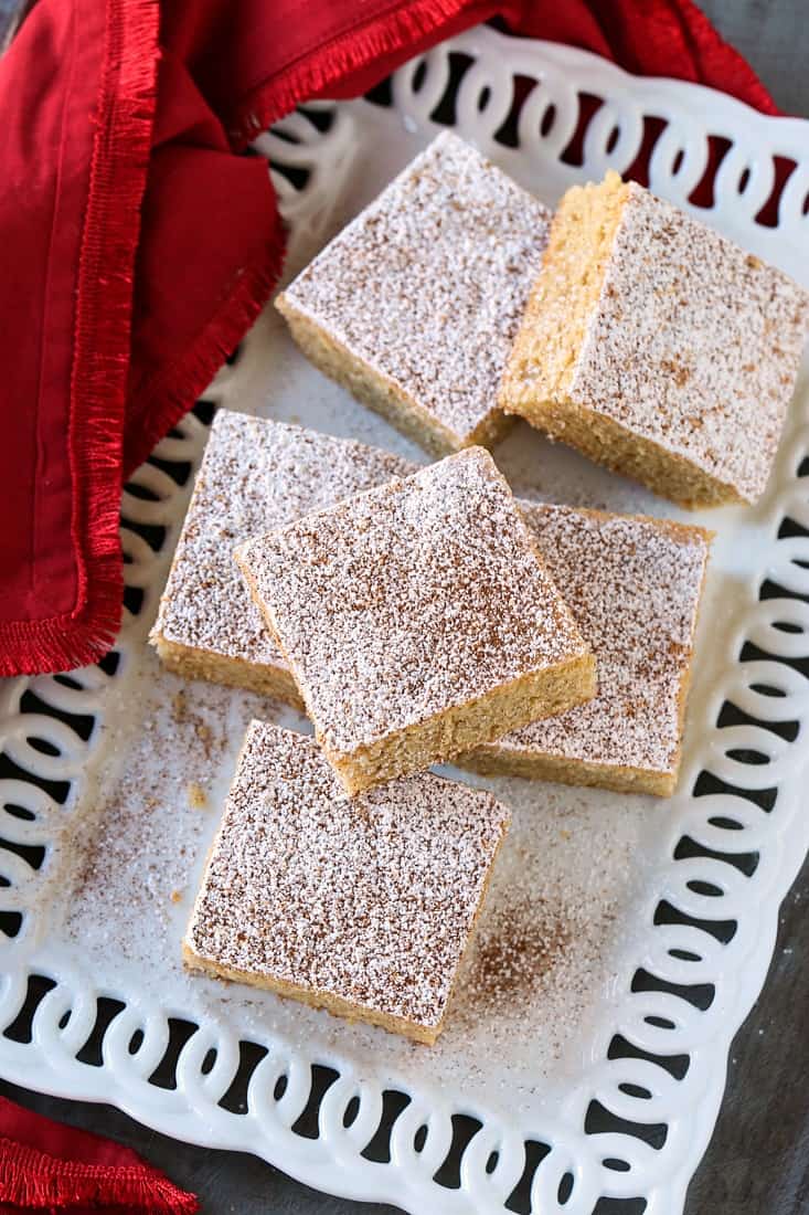 Eggnog cookie bars on a white platter