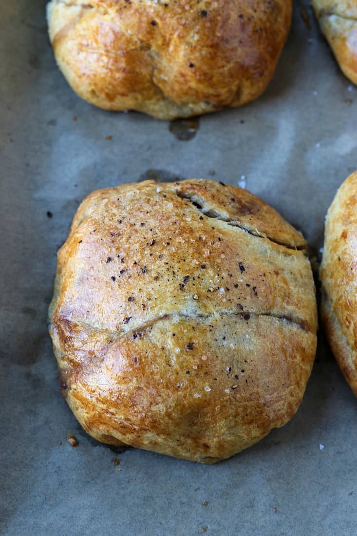 Baked ground beef wellington on a baking sheet