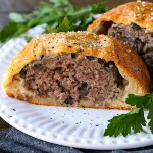 ground beef wellington sliced in half