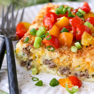 sausage breakfast casserole on plate with forks