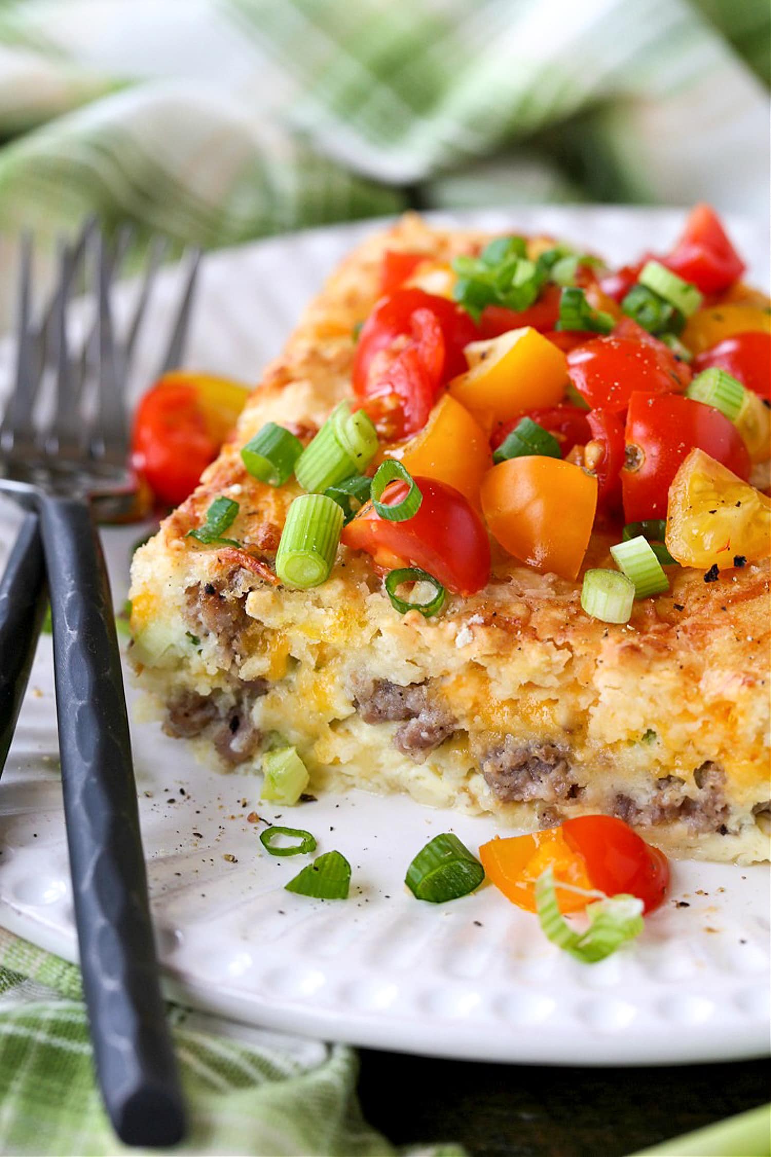 sausage breakfast casserole on plate with forks
