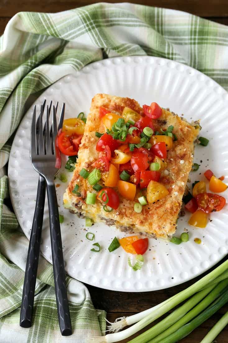 Slice of breakfast casserole recipes on plate with fork