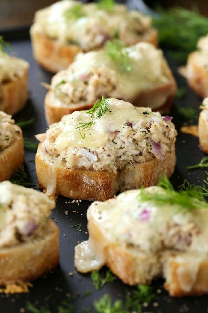 Tuna Melt Bruschetta on a baking sheet with fresh dill