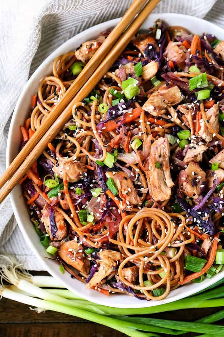 Teriyaki Chicken Noodles are a delicious way to start off the week! This vegetable packed dinner is sure to be a favorite with everyone! Teriyaki Noodles in a bowl with chop sticks and scallions