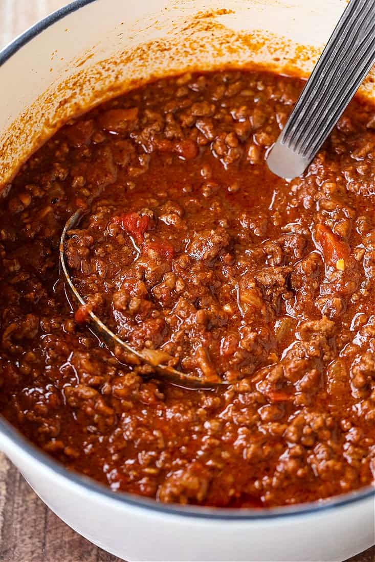 chili recipe in a pot with ladle