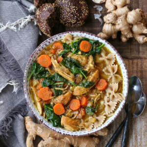 chicken soup recipe with vegetables and whole wheat pasta in bowl