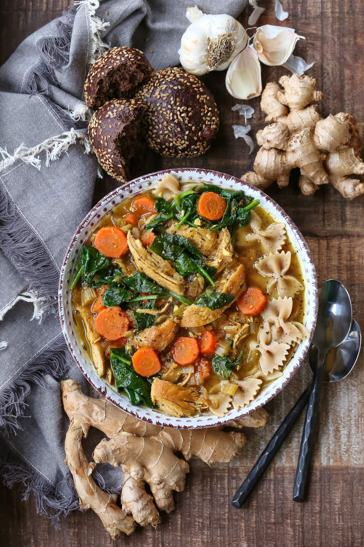 chicken soup recipe with vegetables and whole wheat pasta in bowl