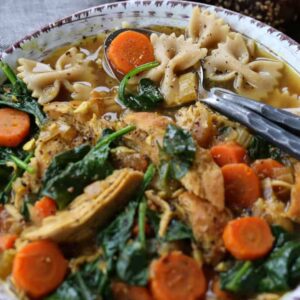 Detox Chicken Soup recipe in a bowl with two spoons
