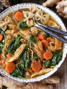 chicken soup with spoons in the bowl