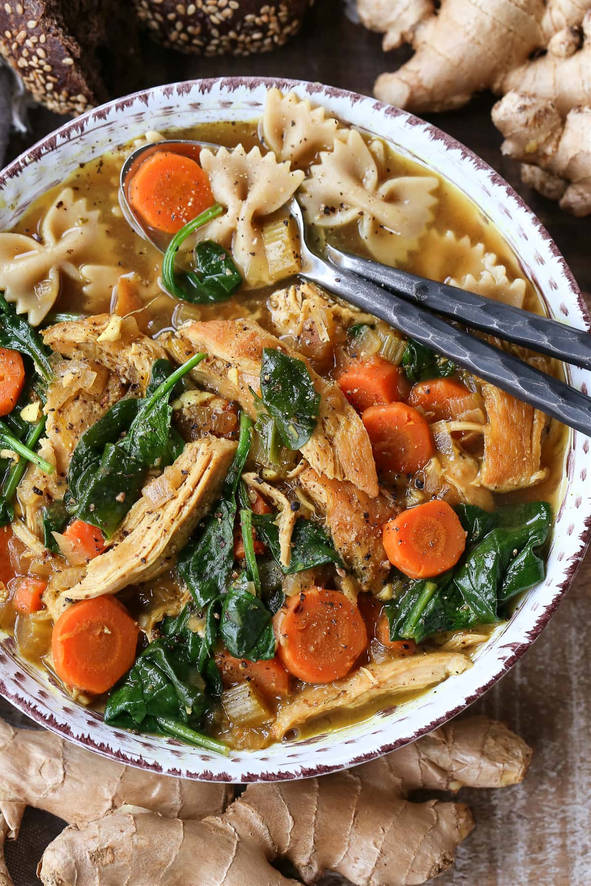 chicken soup with spoons in the bowl