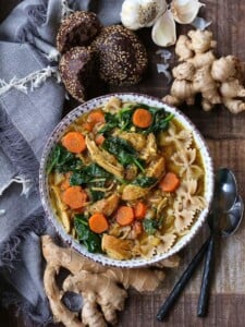 Chicken Soup in a bowl with vegetables and whole wheat pasta