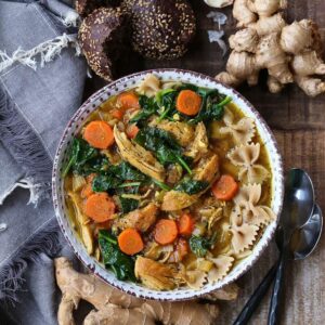 Chicken Soup in a bowl with vegetables and whole wheat pasta