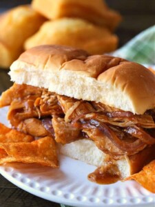 slow cooker chicken on a bun with potato chips