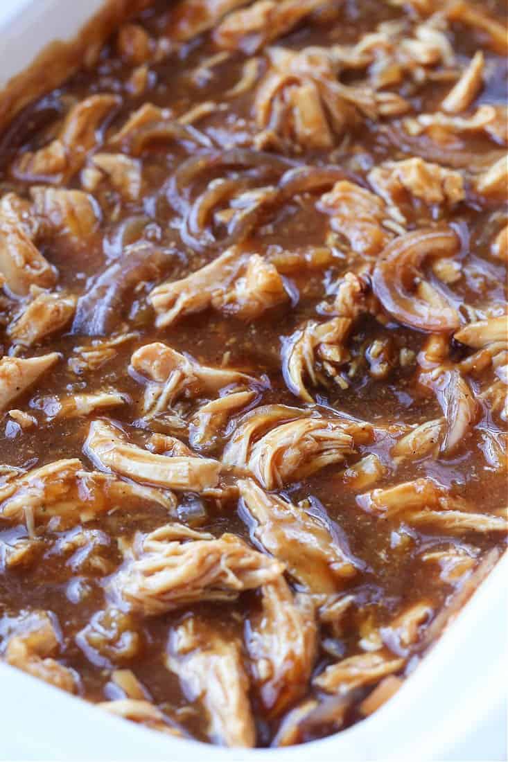 pulled chicken in sauce in a slow cooker