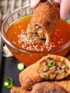 Pork Egg Roll recipe dipping into duck sauce