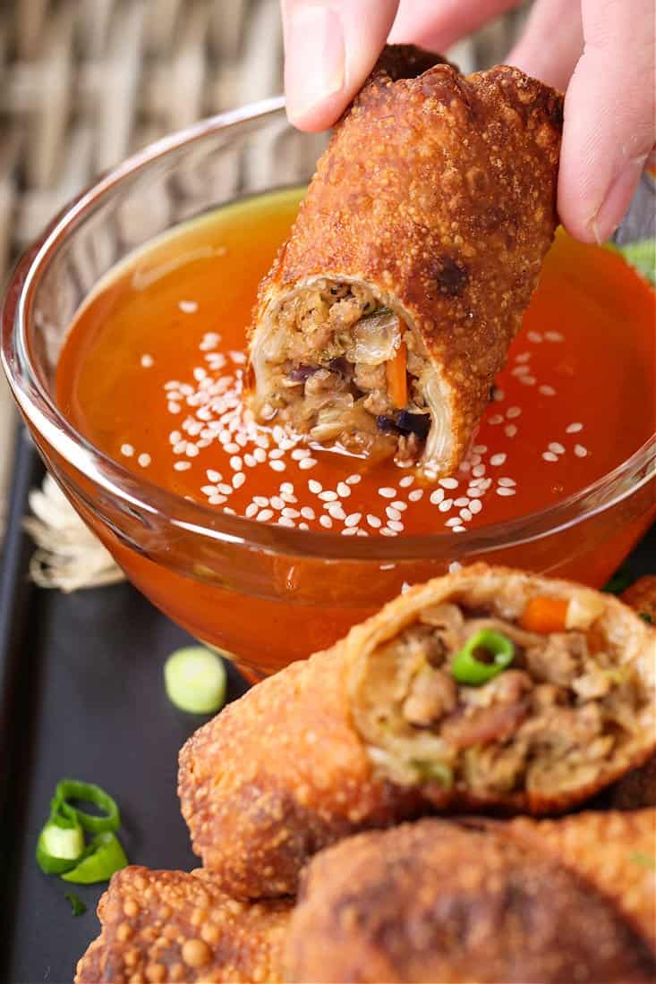 Pork Egg Roll recipe dipping into duck sauce