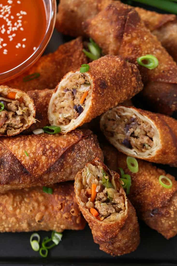 Pork Egg Rolls on a platter with duck sauce