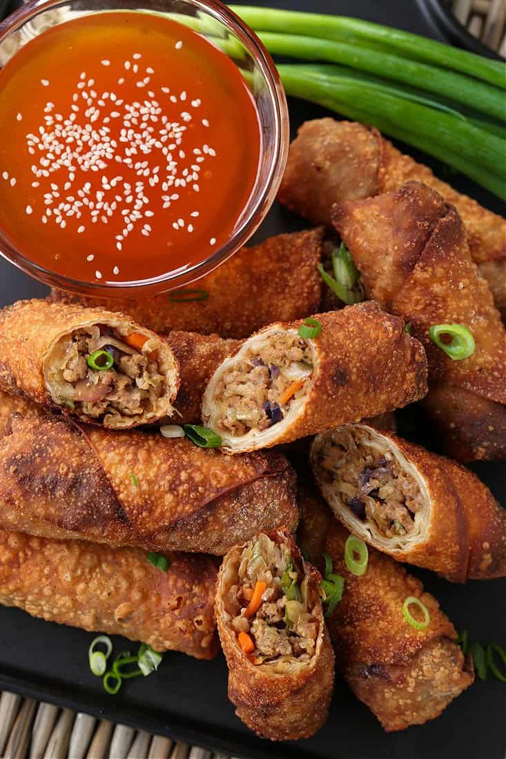 Homemade pork egg rolls on a platter