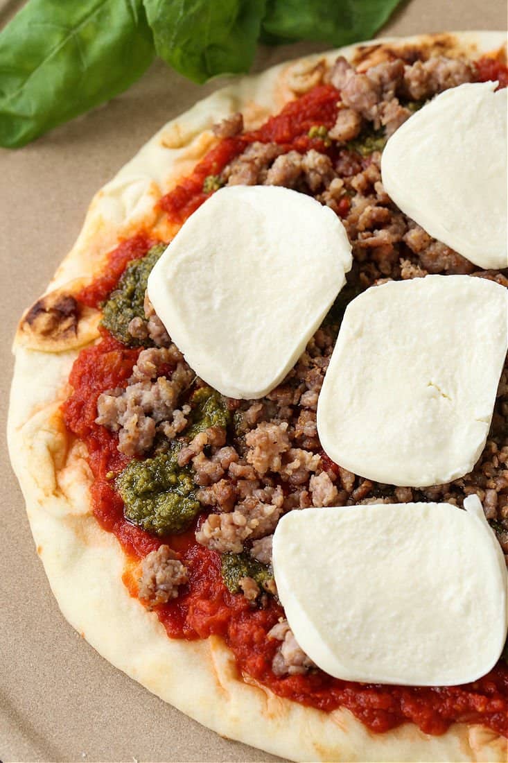 Fresh mozzarella and Italian sausage on a homemade pizza 