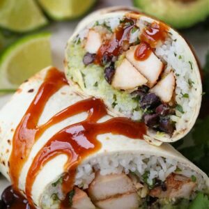 Teriyaki Chicken Burritos with sauce drizzled over the tops