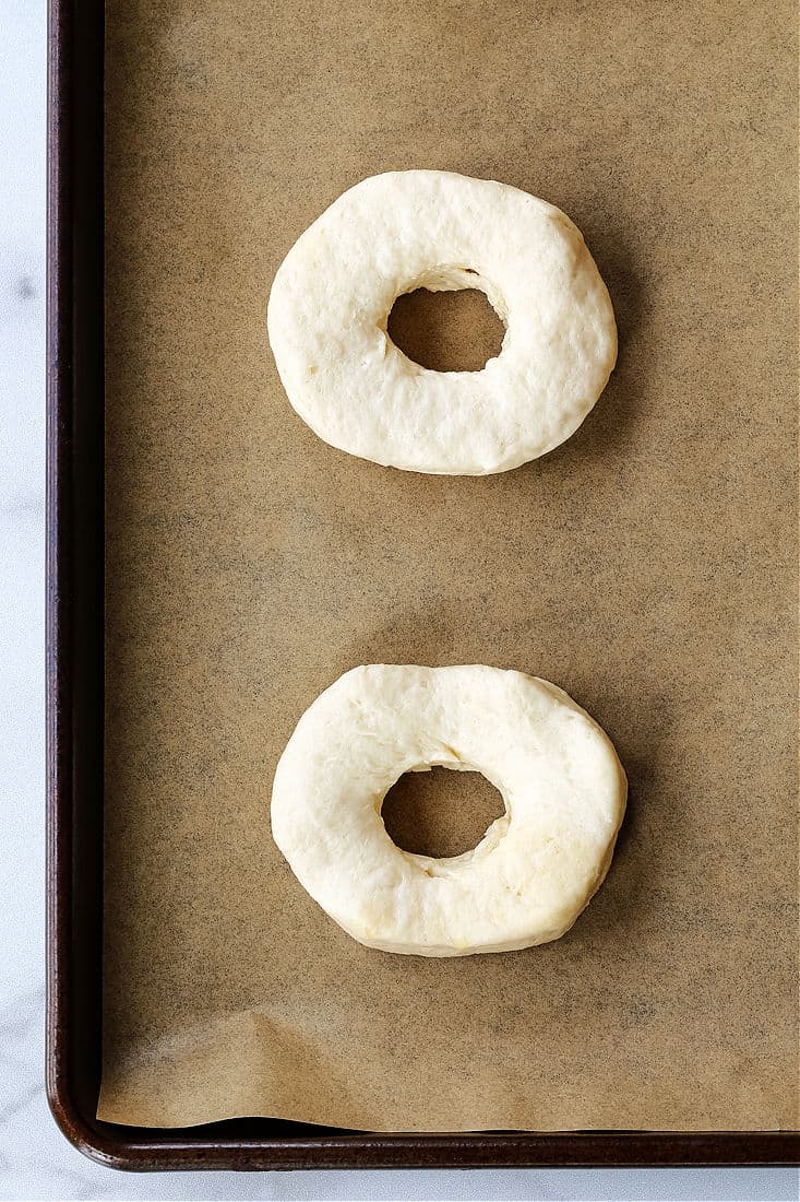 biscuit dough on a baking sheet with a hole in the middle