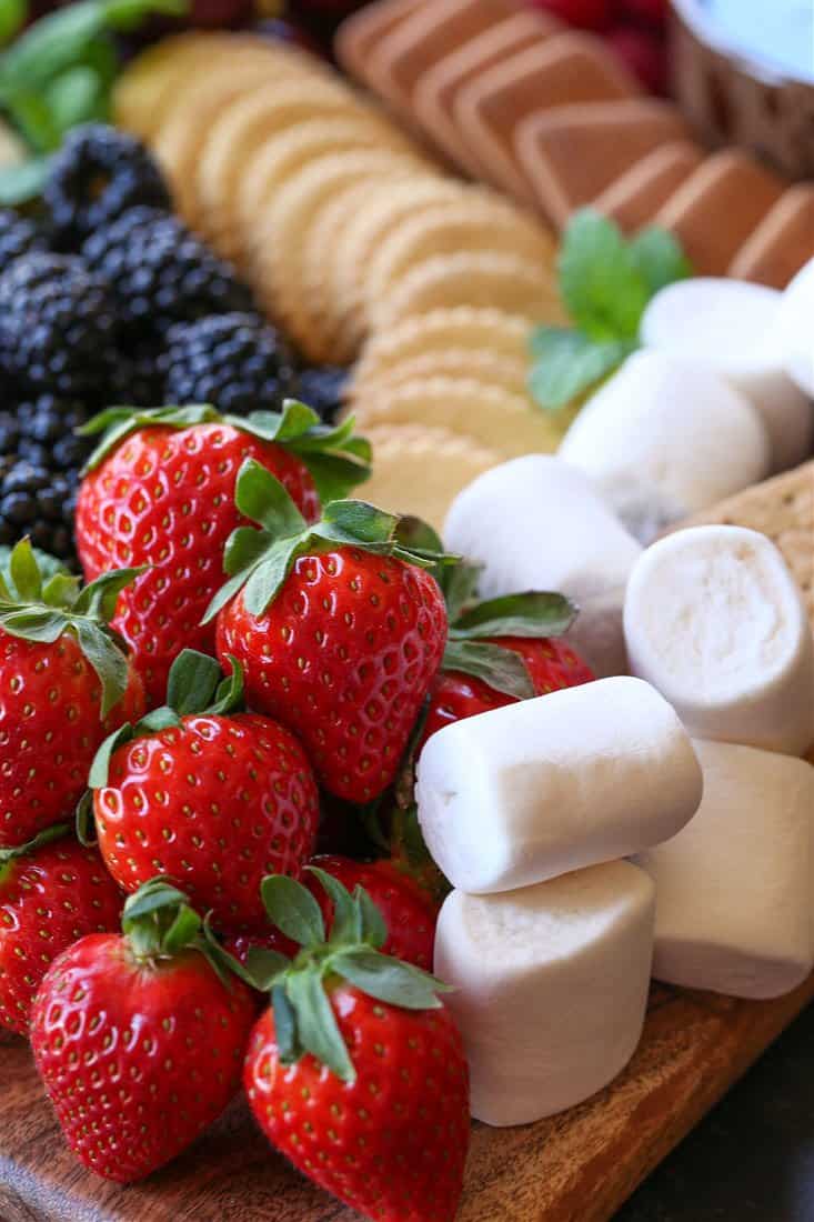 Strawberries, marshmallows and cookies for dipping into chocolate fondue