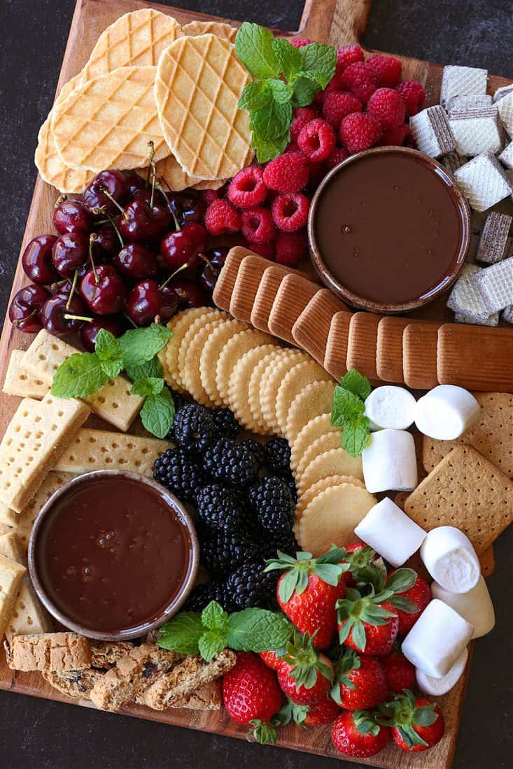 Dessert board with chocolate fondue for dipping