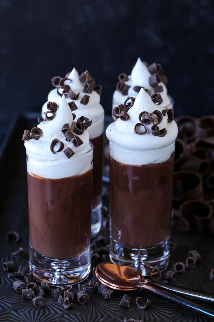 Chocolate Stout Pudding Shots for the beer lover in your life! A hint of flavor from chocolate stout, sweetened with a whipped cream topping! Chocolate pudding recipe with stout beer