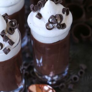 Chocolate pudding shots with whipped cream on top