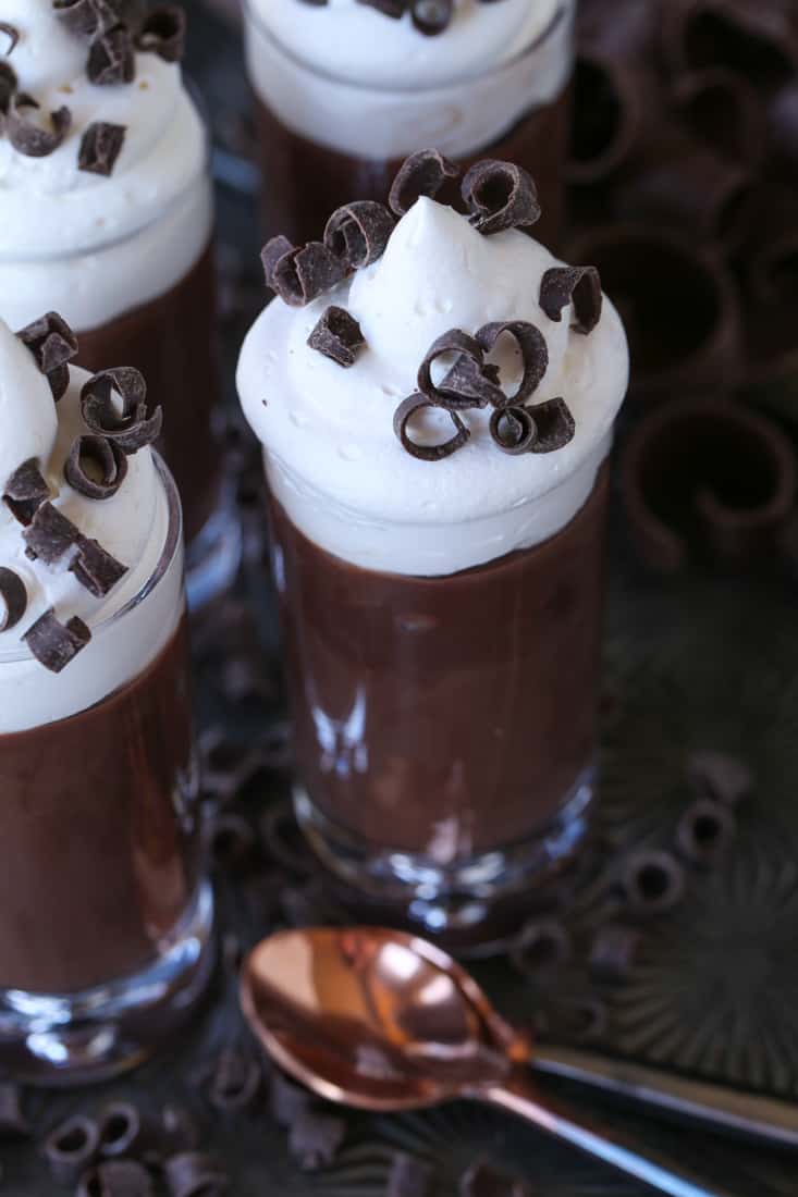 Chocolate pudding shots with whipped cream on top