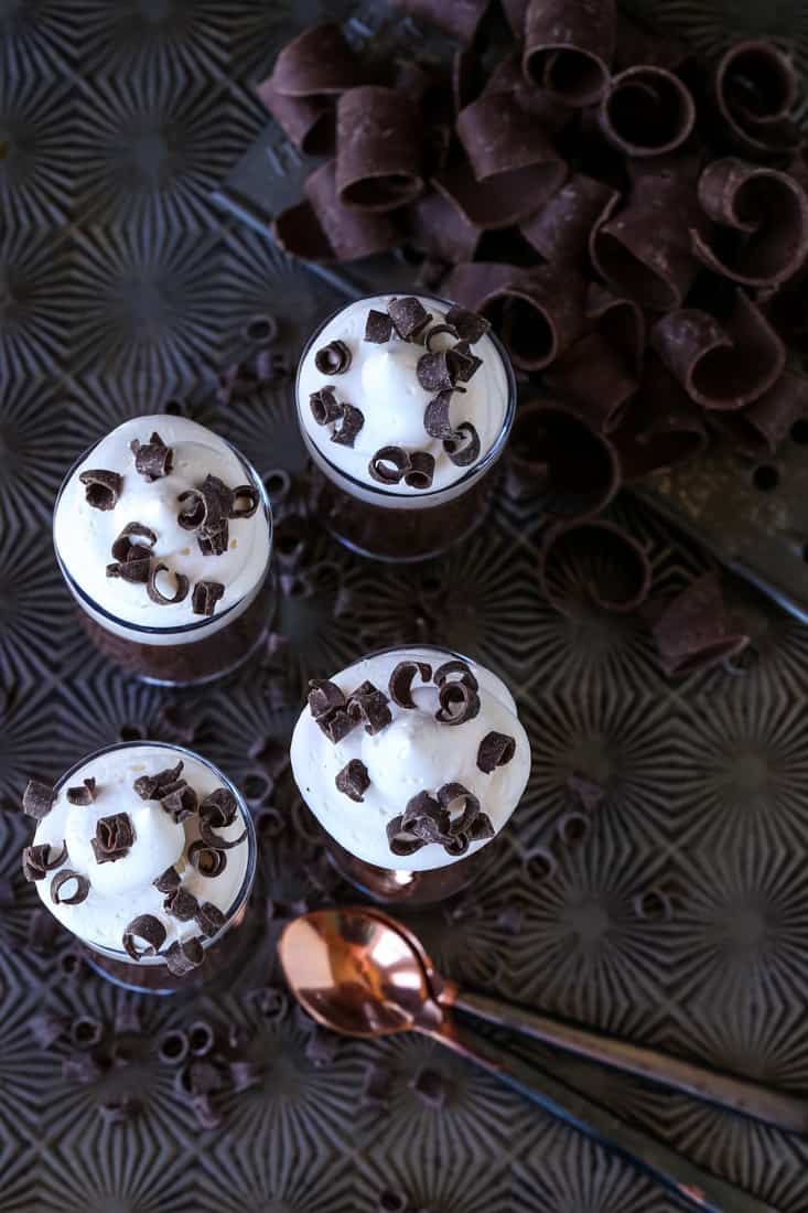 Chocolate stout pudding in shot glasses with whipped cream