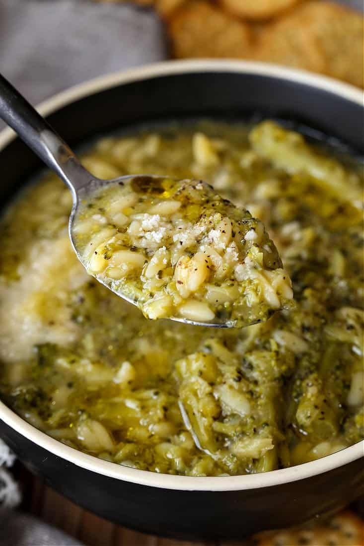 Broccoli soup with orzo on a spoon